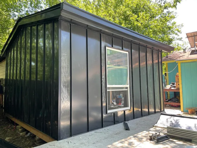 Black standing seam metal wall panels for Roof Inspection in Eidson Road